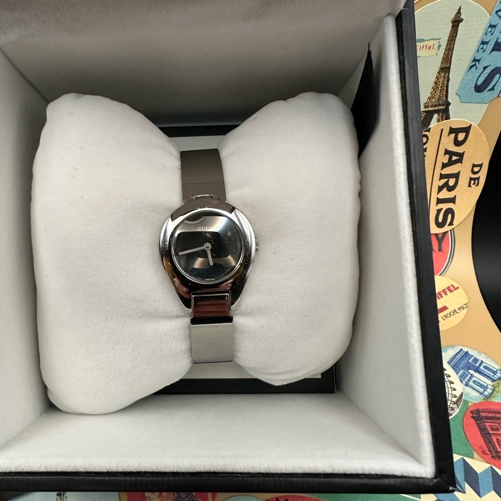 Gucci Classic Silver Dial with a bracelet that buckles like a belt